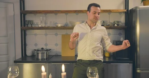 Husband making romantic dinner Stock Footage 114124565