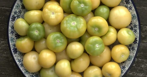 Husked tomatillo on a plate. Stock Footage 307993065