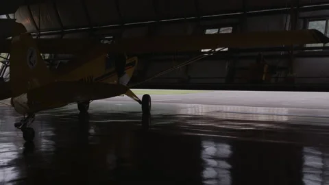 Husky Plane Hanger Door Opens - 3840 x 2160 Stock Footage 221395110
