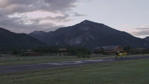 Husky Plane TakeOff (profile pan) 2 - 3840x2160 Stock Footage 221417866