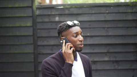 Hustling on the Phone with Sunglasses Stock Footage 89922480