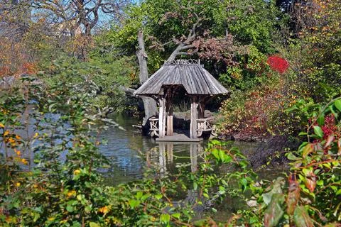 The hut on the pond during fall 写真素材
