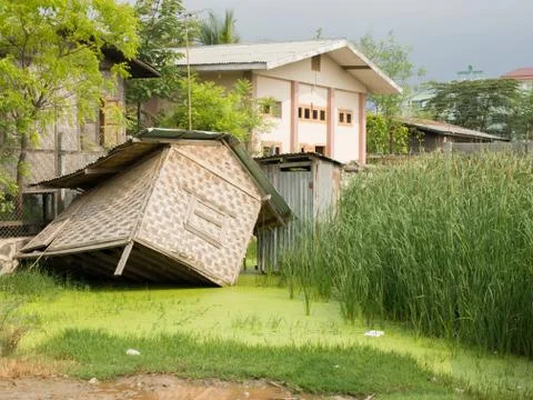 HUT SUBMERGED IN MUD Stock Photos