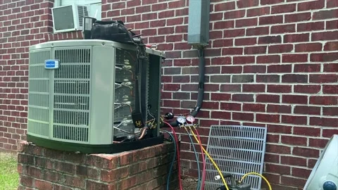 Hvac Ac unit being installed at a house in 4k 60fps push in shot. Stock Footage 202606919
