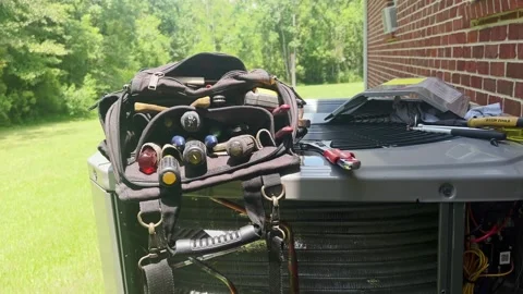 HVAC A:C and tools, A/C unit being installed at a house. Stock Footage 202606030
