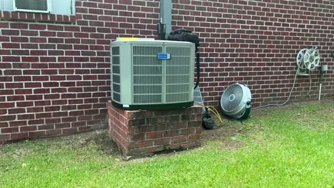 Hvac A/C condensor being installed at a house. Stock Footage 202606127