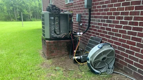 HVAC A:C unit getting installed Stock Footage 202606946