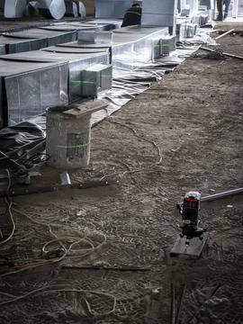 HVAC ductwork installation with laser level Stock Photos