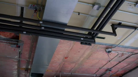 Hvac heating, ventilation, air conditioning systems under ceiling in empty room Stock Footage 320578739