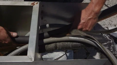 HVAC Service Worker Insulating Pipe Video stock 64053486