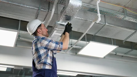 Hvac technician installing air duct system in building Stock-Footage 314568795