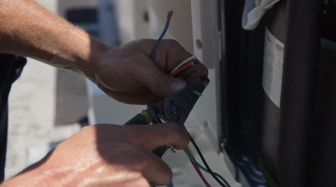 HVAC Worker Stripping Wire Video stock 64053576