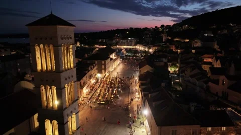 Hvar Bell Tower Illuminated Over The Main Square At Night Video stock 342163456