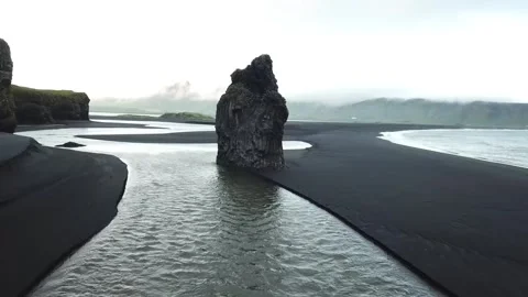 Hvitserkur - iconic sea stack on volcanic black beach Stock Footage 240434019
