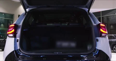 Hybrid car in the showroom automatic trunk opening. automatic Trunk opening Stock Footage 304090440