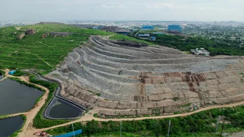 Hyderabad Integrated Municipal Solid Waste plant with city scape and large size Stock Footage 323049796