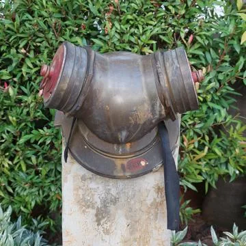 Hydrant installed in the garden area Stock Photos