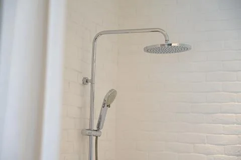 Hydrant shower in the white bathroom Fotos Stock