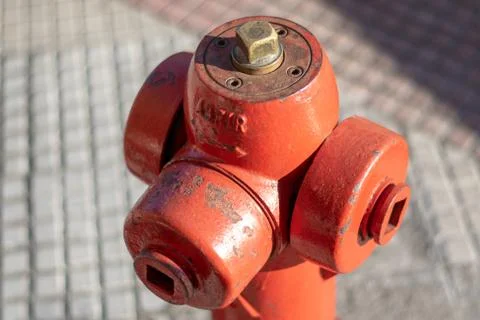 Hydrant on the sidewalk whith the word abrir that means open in spanish. Stock Photos