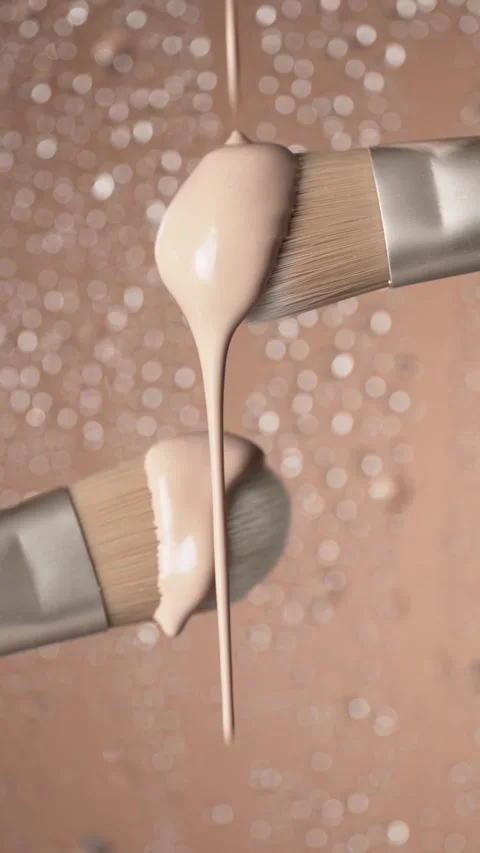 Hydrating Foundation falling on brushes. Stock Footage 307304980