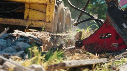 Hydraulic Attachment Clearing Debris Beside Backhoe Loader Stock Footage 337830297