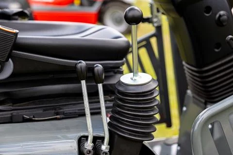 Hydraulic control levers with protective boot in operator station Stock Photos