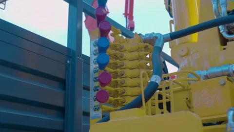 Hydraulic control unit with multiple levers on a truck lift at an exhibition Stock Footage 333326326