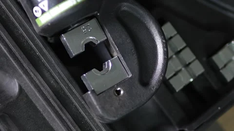 Hydraulic crimping tool head with installed size twenty five die. Stock Footage 344365461
