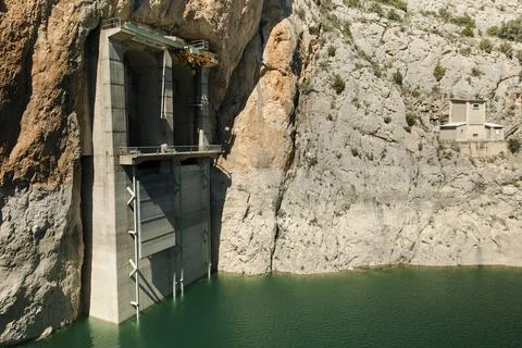 Hydraulic Dam Structure Built into Rock Cliff Stock Photos