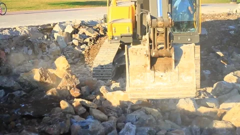Hydraulic digger working for formation of new land by filling the sea. A crawler Stock Footage 287777317