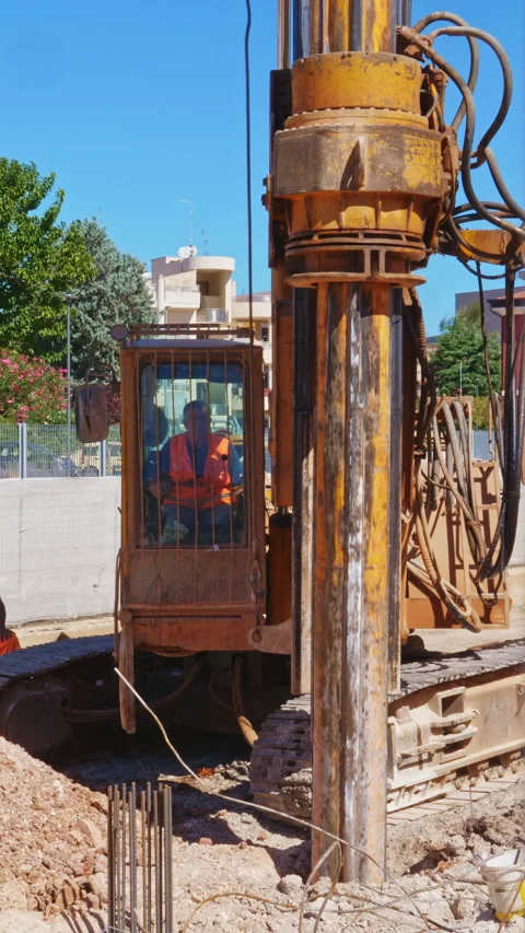 Hydraulic drilling rig for Installing a bored piles with a casing string on a Stock-Footage 293081419