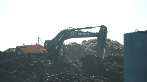 Hydraulic Excavator Reshaping Garbage Mountain At Delhi Landfill Site Stock Footage 248057593
