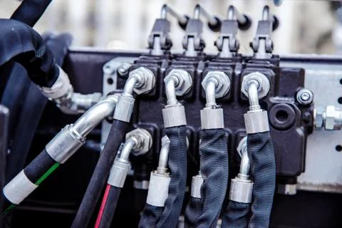 Hydraulic hoses connected at shallow depth of field Stock Photos