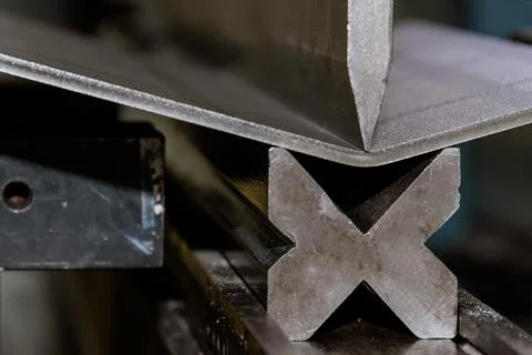 An hydraulic machine, which has been designed to bend sheet metal, is used for Stock Photos
