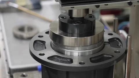 Hydraulic press machine forming precision bearing hub and flange component for Stock Footage 334965597