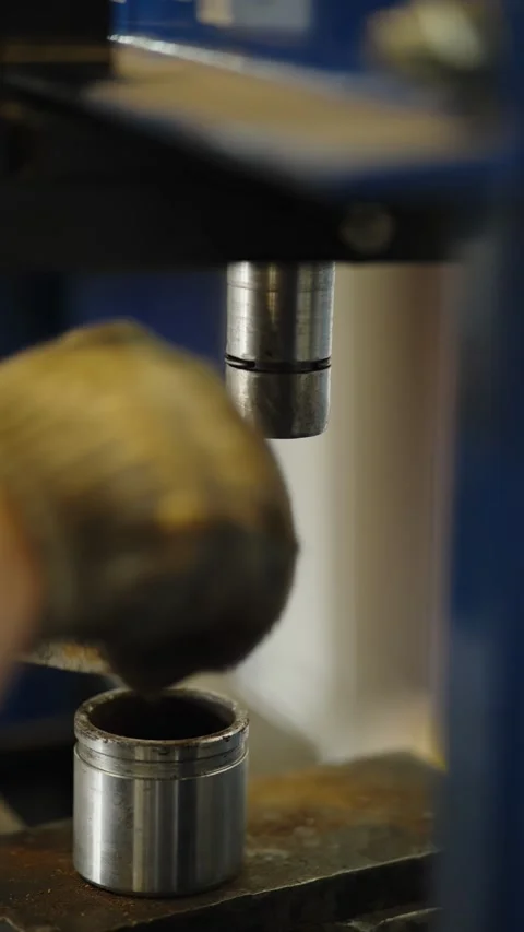 Hydraulic press machine pressing out car bushing from control arm Stock Footage 337567980