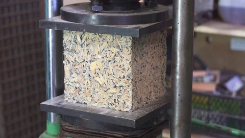 Hydraulic press tests the strength of the building block arbolite Stock Footage 90335145