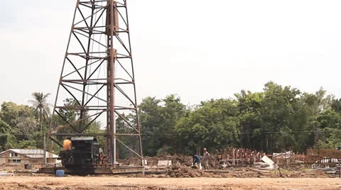 Hydraulic ram pile driver on construction project Stock Footage 23761671