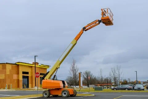 Hydraulic system elevated platform at high in a boom lift crane Stock Photos