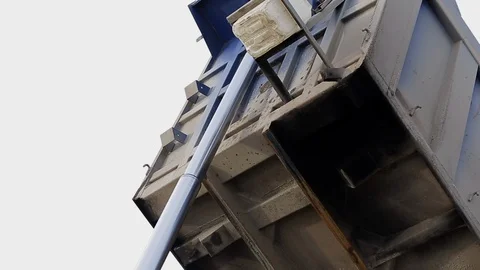 Hydraulic system lowers empty dump truck body after unloading to normal position Stock Footage 115925142