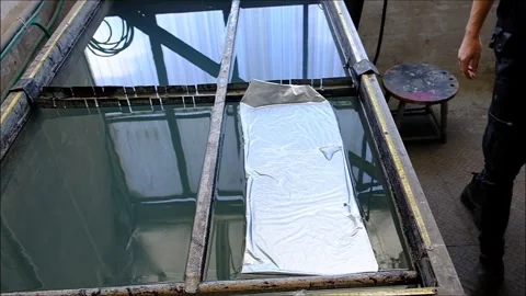 Hydro Dipping Process: Carbon Fiber Film on Water Surface in Car Workshop Stock Footage 314346340