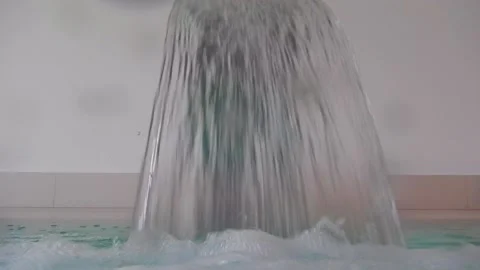 Hydro Massage Pool with Falling Water in Swimming Pool Stockbeeldmateriaal 194012412