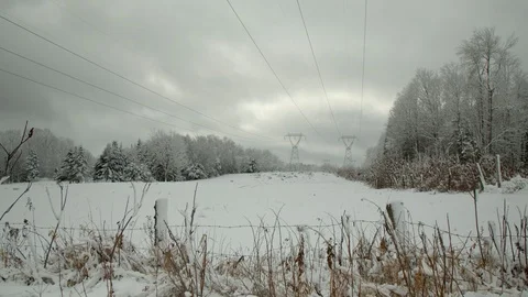 Hydro power lines in the winter after a snowfall in forest, 4k Stock Footage 120358630