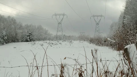 Hydro power lines in winter snowfall industrial in nature, 4k Stock Footage
