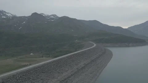 Hydroelectric dam and reservoir at Mont Cenis pass in the Alps Video stock 337874341
