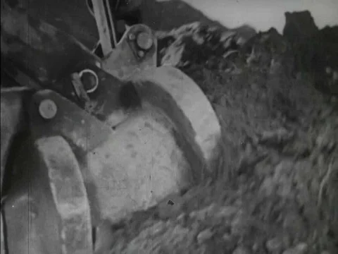 A hydroelectric dam being built in the mountainous region of Japan in 1957. Video stock 75292369