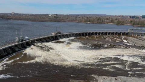 Hydroelectric dam with powerful water currents surging over its structure Stock Footage 273869540