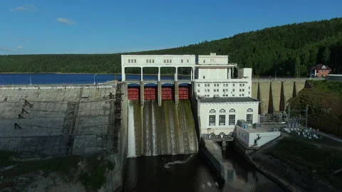 Hydroelectric dam with water flows through gates. Dam in Russia. Stock Footage 160549494