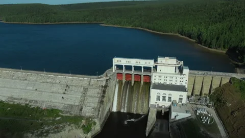 Hydroelectric dam with water flows through gates. Dam in Russia. Stock Footage 160601236