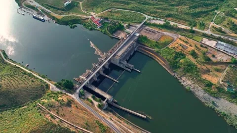 Hydroelectric power plant overview with dam and water flow Stock Footage 336192563